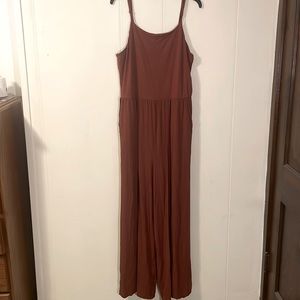 Rusty pink wide-leg spaghetti strap jumpsuit with pockets and adjustable straps!
